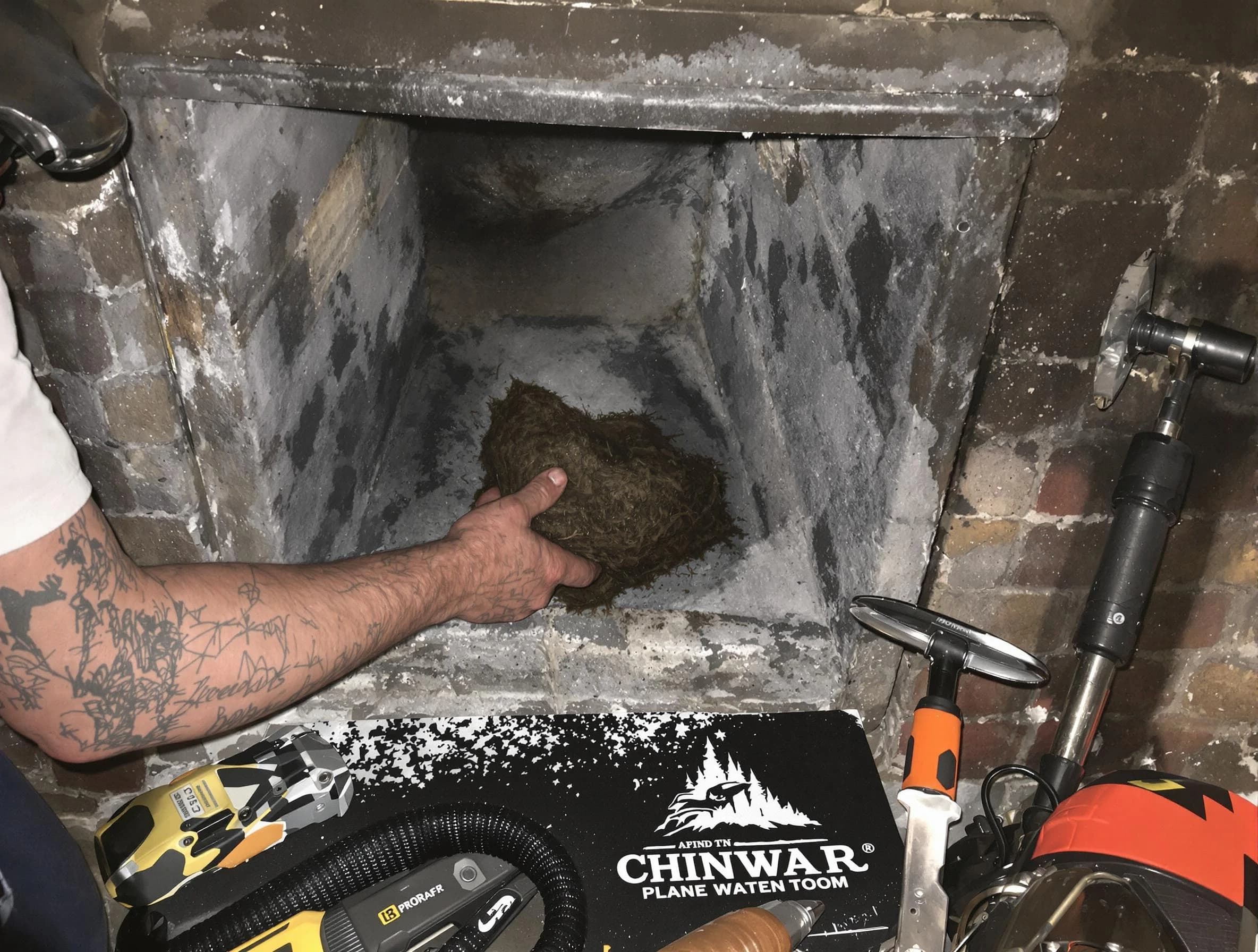Woodstock Chimney Sweep safely removing debris and screening chimney in Woodstock, GA